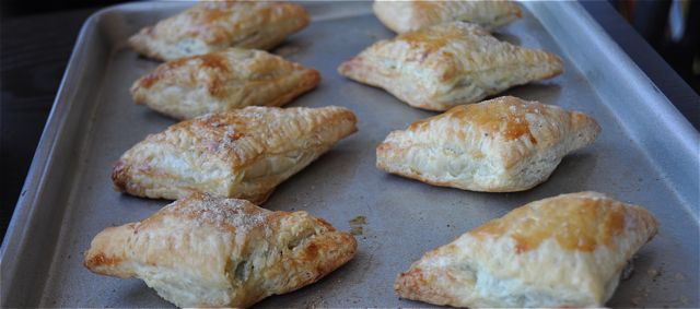 puff pasty samosas on tray